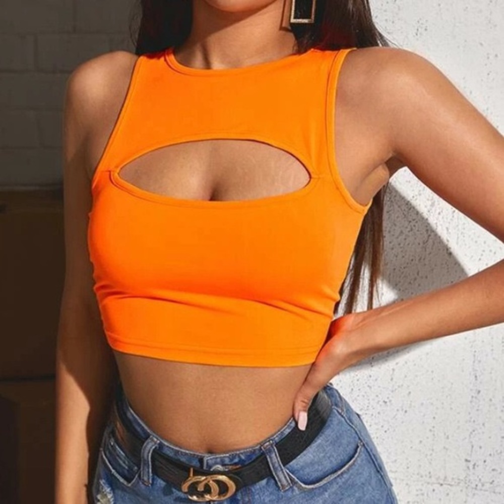 RAVE NEON ORANGE CUT OUT TANK TOP. PERFECT FOR GOING OUT AND PARTIES! NEVER WORN